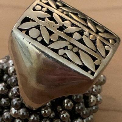 Heavy solid Sterling Ring / leaf pattern on face