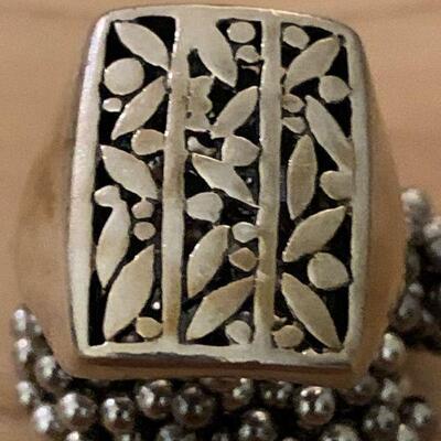 Heavy solid Sterling Ring / leaf pattern on face