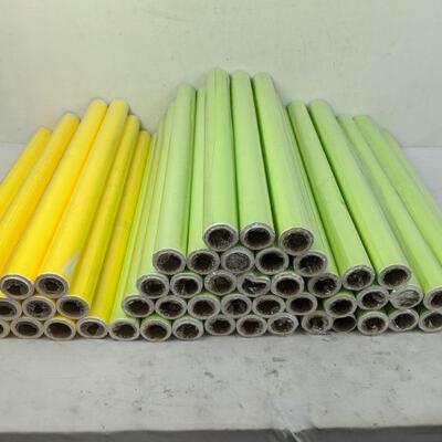 12 Yellow and 40 Green Rolls of Wrapping Paper, 2' Wide - Nearly All New