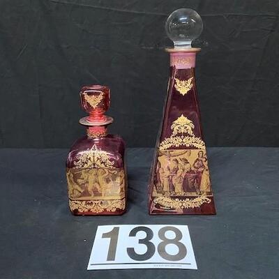 LOT#138: Pair of Gold Trimmed Cranberry Glass Decanters
