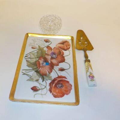 vintage ceramic serving plate and knife with Waterford Vase.