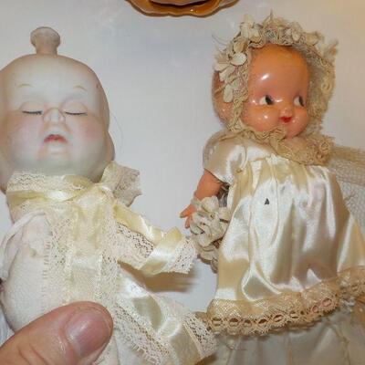 2- vINTAGE - 3 sided face doll vintage and 1900's bisque baby doll.