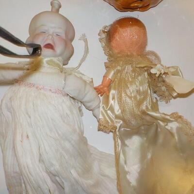 2- vINTAGE - 3 sided face doll vintage and 1900's bisque baby doll.