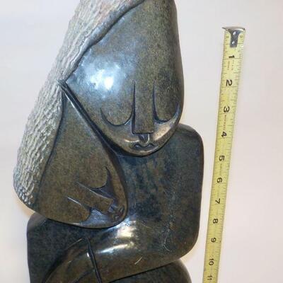 African carved serpentine stone sculpture of two people. Signed â€œH. Ncubeâ€  Likely from Zimbabwe.