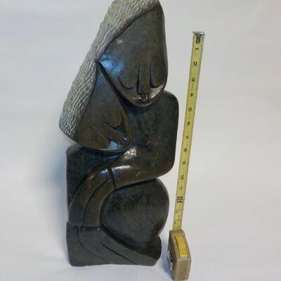African carved serpentine stone sculpture of two people. Signed â€œH. Ncubeâ€  Likely from Zimbabwe.