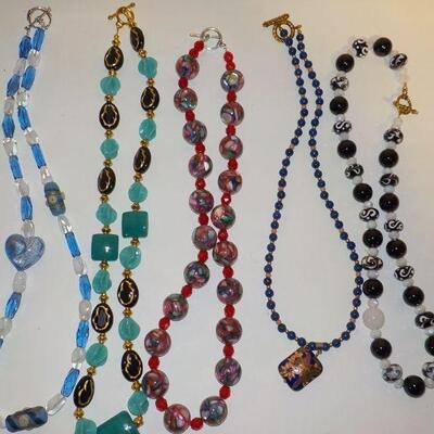 New hand crafted necklaces w/ real and synthetic stones.