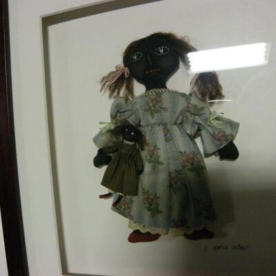 Black Art by C Spence Sellnes..Carol Spence Selner hand made and framed black doll with miniature doll. Signed in pencil lower right....