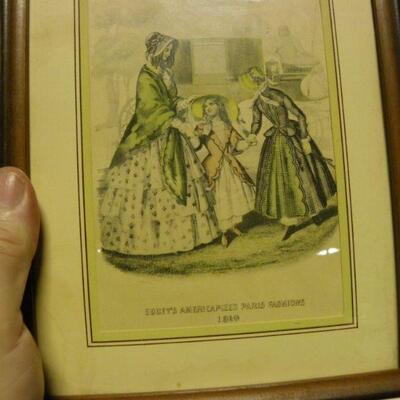 Lot of two pictures: Framed hand-colored page of Godey’s Americanized Paris Fashions, 1860; Framed fabric and ribbon art girl with a...