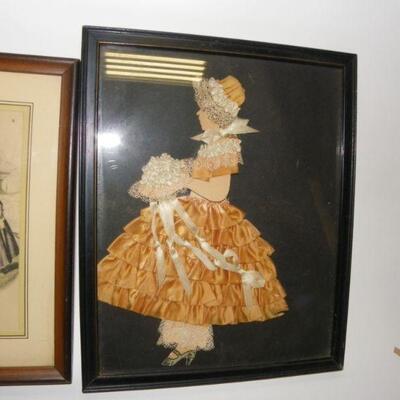 Lot of two pictures: Framed hand-colored page of Godeyâ€™s Americanized Paris Fashions, 1860; Framed fabric and ribbon art girl with a...