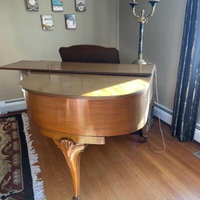 Antique baby grand piano