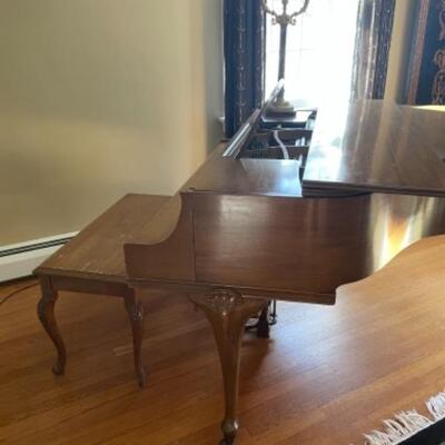 Antique baby grand piano