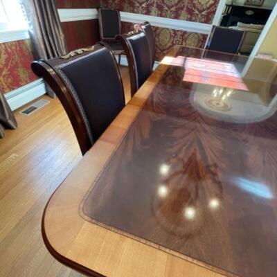 Dining room table with 10 custom Italian chairs and two additional leaves