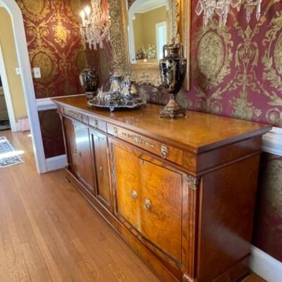 Antique sideboard with gold accents
