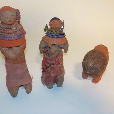 3 Antique handcrafted dolls and lion.