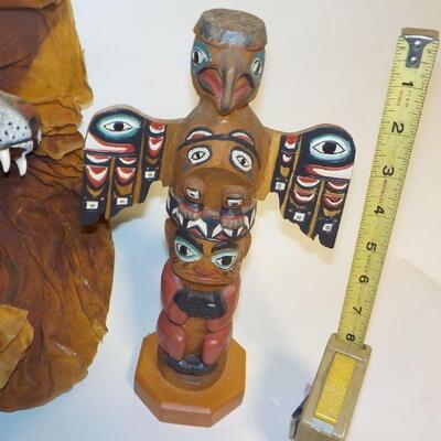 Patrick Seale signed Inuit totem, and sculpted, painted leather wall art of woman and bobcat head. 