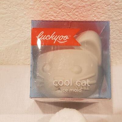 Lot 132. New Game, Socks, Lip Balm & Cool Cat Ice Mold