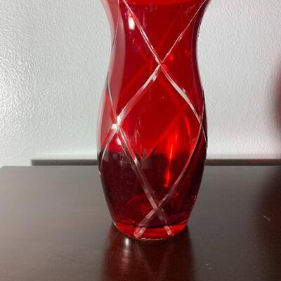 Red vase with etched clear lines accenting 