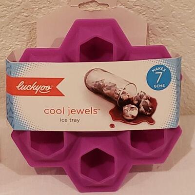 Lot 215: Gift Lot Socka, Jewel Ice Tray, Cupcake Ornaments and Lip Balm