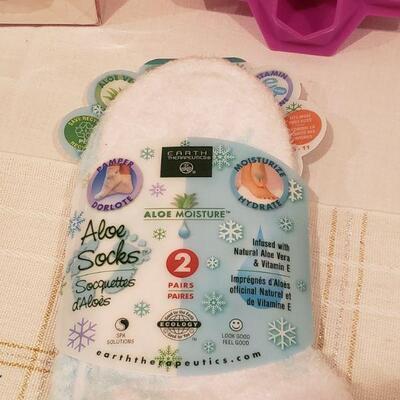 Lot 215: Gift Lot Socka, Jewel Ice Tray, Cupcake Ornaments and Lip Balm