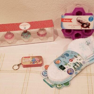 Lot 215: Gift Lot Socka, Jewel Ice Tray, Cupcake Ornaments and Lip Balm