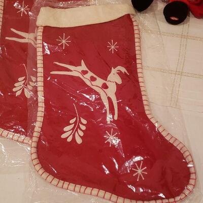 Lot 235: NEW (3) Christmas Stockings, Santa Plushie & JOY Sign