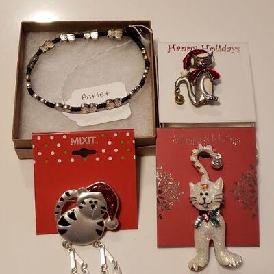 Lot 294: (3) Cat Holiday Brooches and Anklet