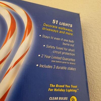 Lot 318: 12 Candy Cane Christmas Light Stakes (3 more boxes not shown)