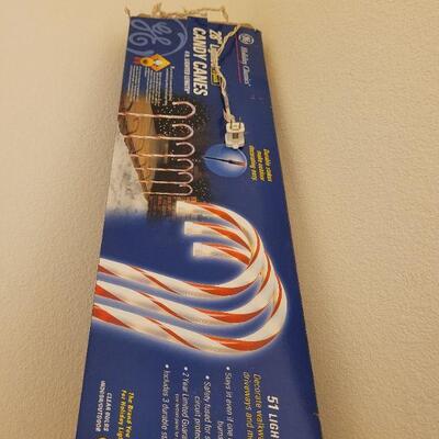 Lot 318: 12 Candy Cane Christmas Light Stakes (3 more boxes not shown)