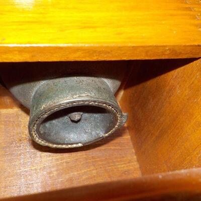 Vintage coffee grinder and wood boat model.