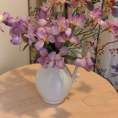 Water pitcher with floral arrangement 