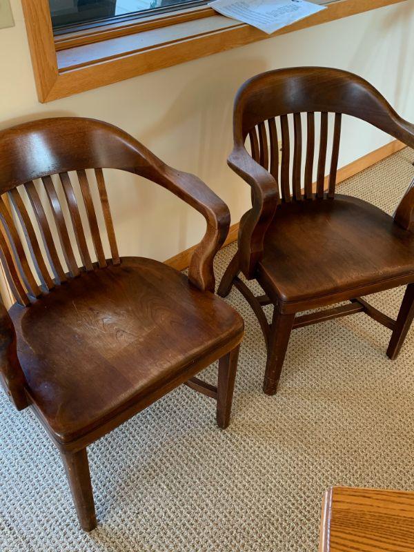 Two antique wooden office chairs