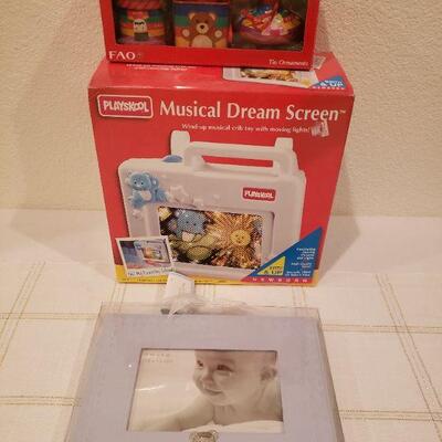 Lot 365: NEW/Old Stock Playskool Baby Musical Dream Screen, FAO Toy Ornaments and "Prince" Embossed Picture Frame