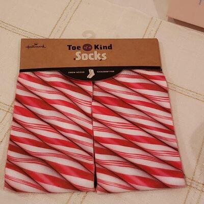 Lot 367: NEW Down Packable Pink Blanket, Canvas Message Art & Candy Cane Socks