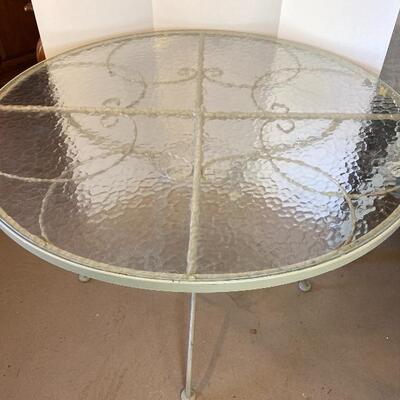 Lot# 217 Round Exterior Wrought Iron Glass Top Table and Chair 