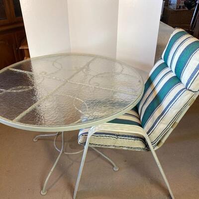 Lot# 217 Round Exterior Wrought Iron Glass Top Table and Chair 
