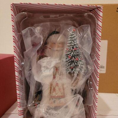 Lot 523: Hallmark Porcelain Santa Figure + Rudolph Figure 