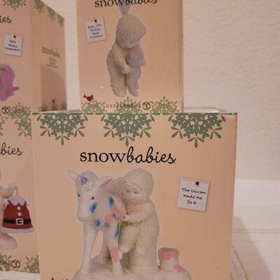 Lot 529: Assorted Dept. 56 Snowbabies Christmas Figures