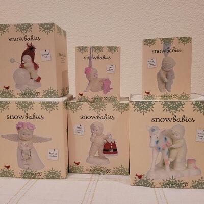 Lot 529: Assorted Dept. 56 Snowbabies Christmas Figures
