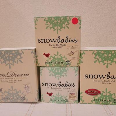 Lot 648: Assorted Dept 56 Snowbabies Christmas Figures 