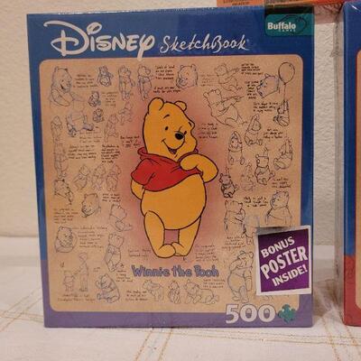 Lot 653: Mickey and Pooh NEW Puzzles 500 pc + 100 pc New Cat Puzzle