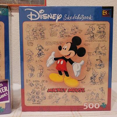 Lot 653: Mickey and Pooh NEW Puzzles 500 pc + 100 pc New Cat Puzzle