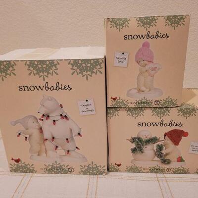 Lot 655: Assorted Dept 56 Snowbabies Christmas Figures 