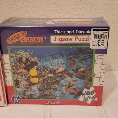 Lot 661: NEW Puzzles Coca Cola 1000 pcs + 200 pc Ocean Scene