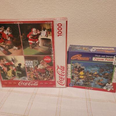 Lot 661: NEW Puzzles Coca Cola 1000 pcs + 200 pc Ocean Scene