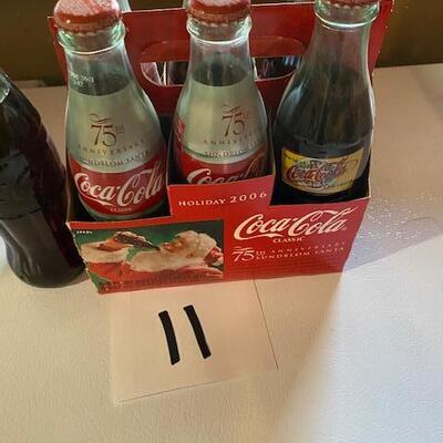 7 Coca Cola bottles