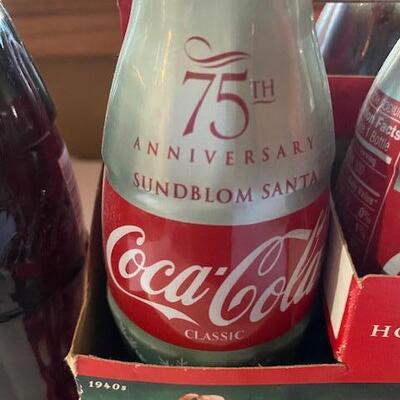 7 Coca Cola bottles