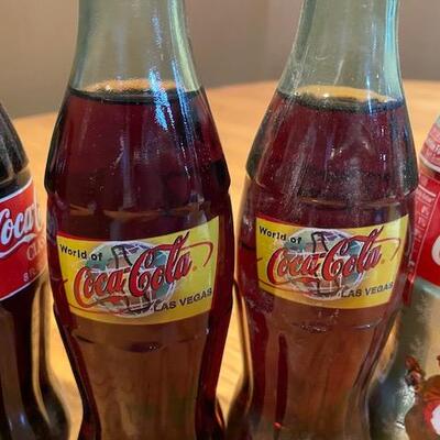 7 Coca Cola bottles