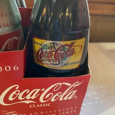7 Coca Cola bottles