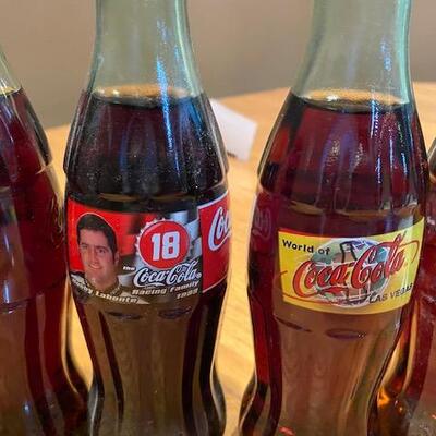 7 Coca Cola bottles