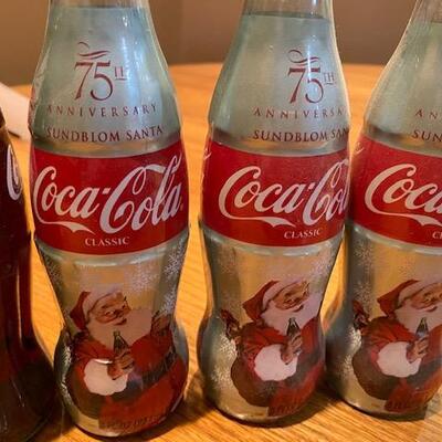 7 Coca Cola bottles